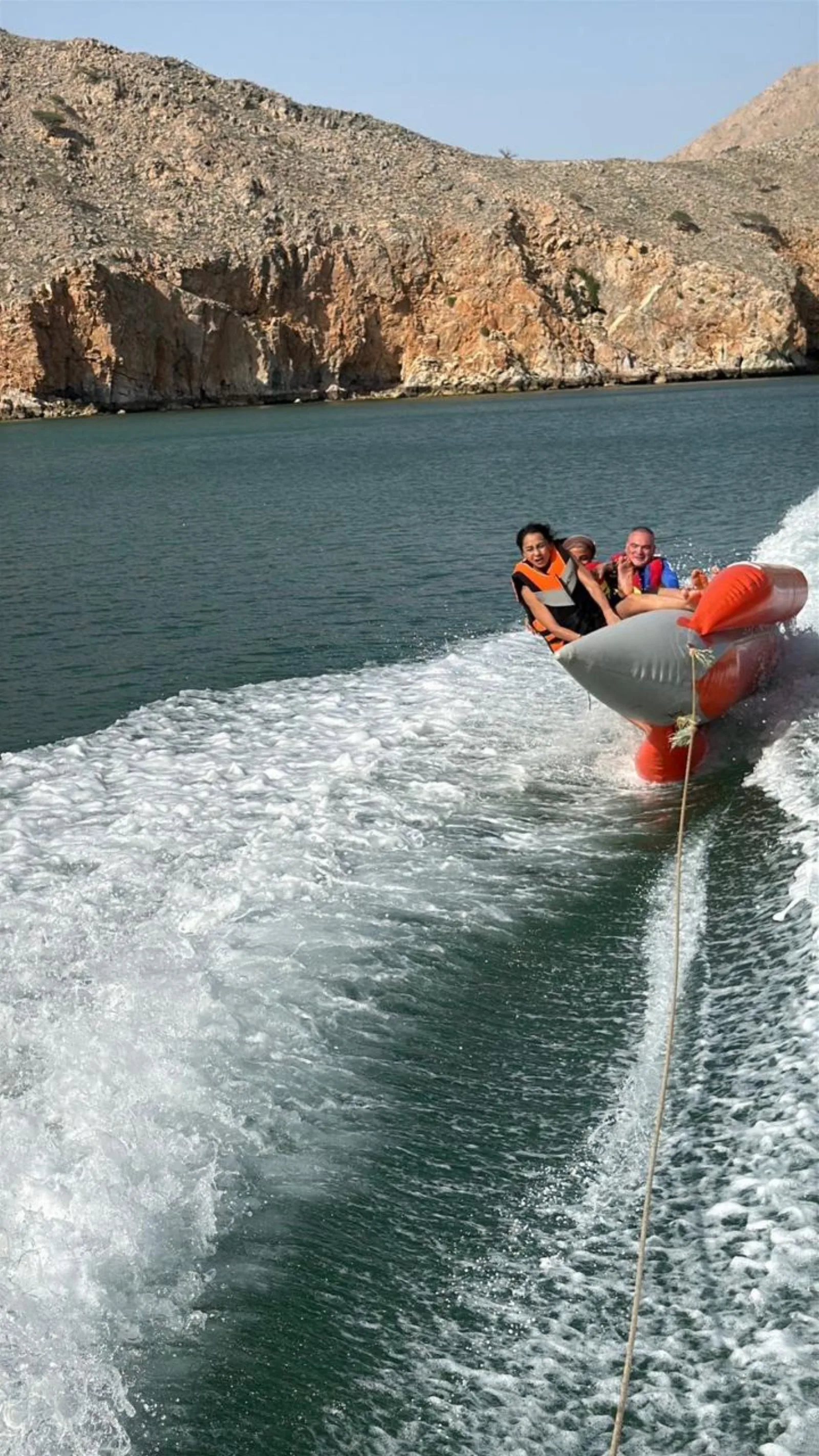 The banana boat behind the speedboat